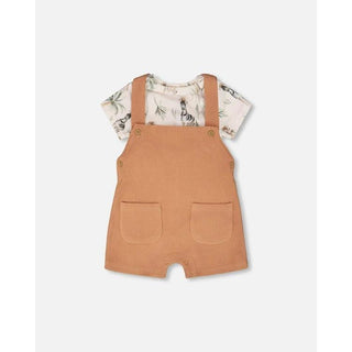 Ensemble cache couche et salopette